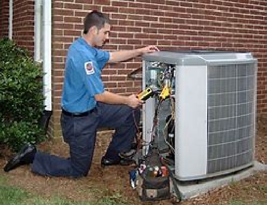 Airconditioner being serviced.